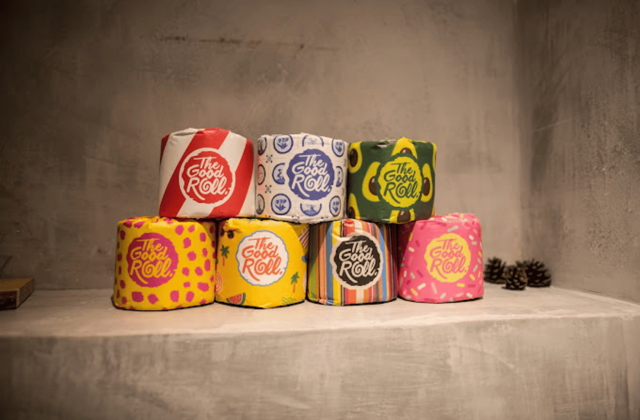 A group of colorful tin cans sitting on top of a table, adding a touch of vibrancy to the environment.